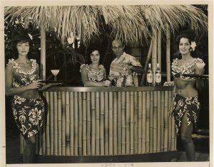 A vintage photo showing Hawaiian clad staff at a catering event.