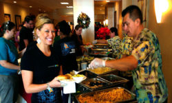 Close up view of a happy event participant being served at an off-site banquet catered by the Mai-Kai.
