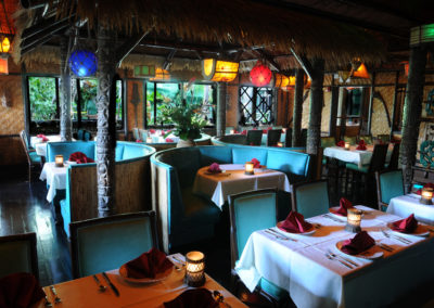 View of the Tahiti dining room with windows overlooking the Mai-Kai gardens.