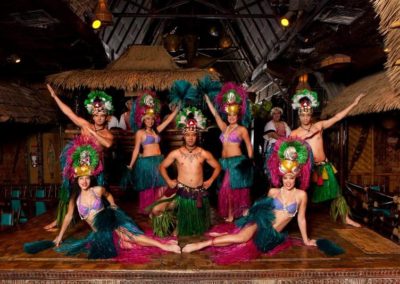 Polynesian Revue dancers in a theatrical group pose on the Mai-Kai stage.