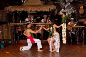 Romantic moment captured between two dancers performing the Polynesian Wedding Dance.