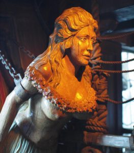 A nautical figurehead in the shape of a woman in The Molokai Bar.
