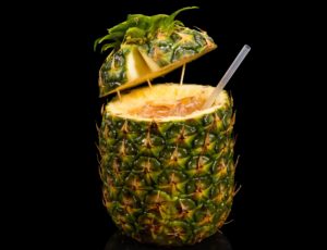 The Pina Passion drink served in an actual pineapple.